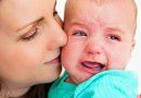 Mother settling crying baby