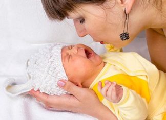 Mother soothing her crying baby