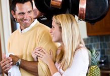 father and teen daughter smiling