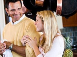 father and teen daughter smiling