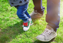 toddler-dad-learning-to-walk-shoes-park-grass