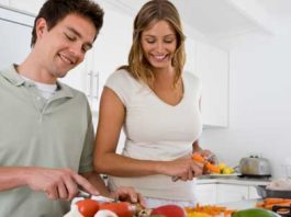 couple preparing vegetables in the kitchen