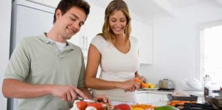 couple preparing vegetables in the kitchen