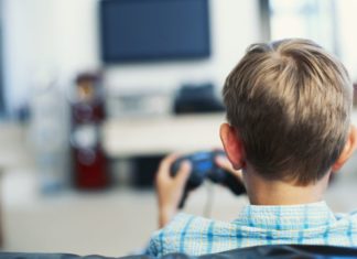 Boy plays video game