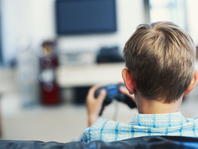 Boy plays video game