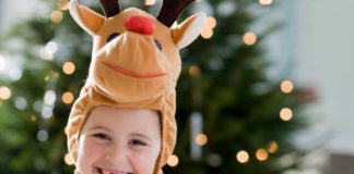 Boy wearing reindeer costume