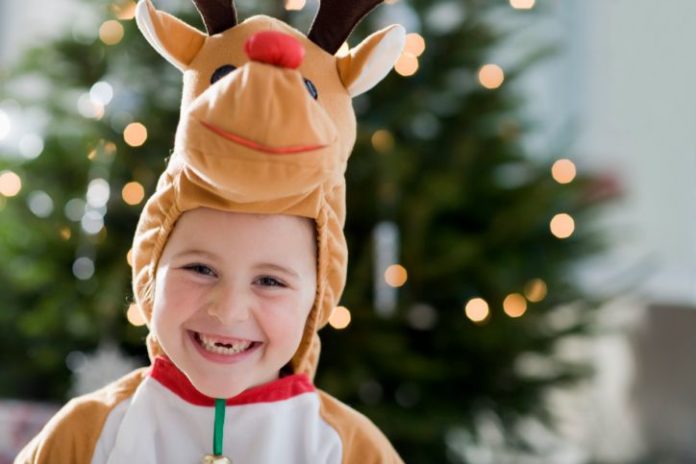 Boy wearing reindeer costume