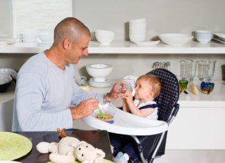 Father feeding baby