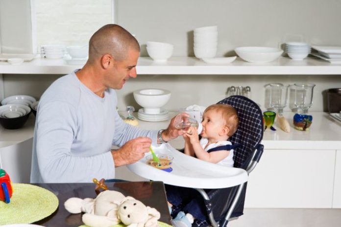 Father feeding baby