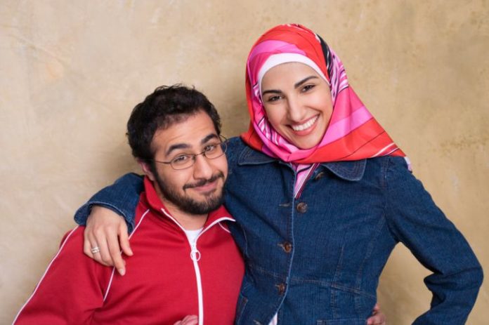 A smiling and playful young couple.