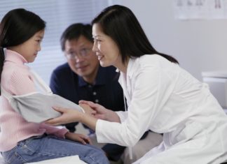 Girl in hospital with doctor