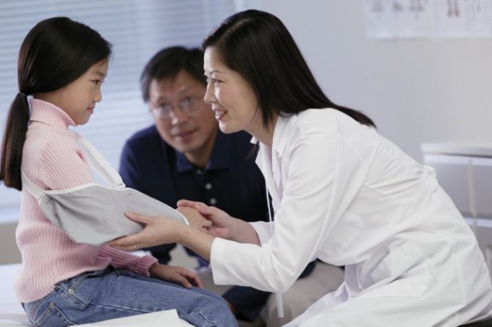 Girl in hospital with doctor