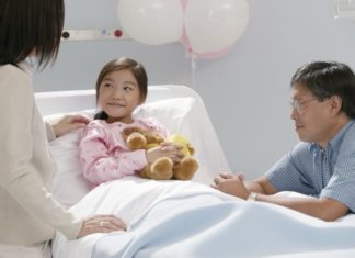 Parents with daughter in hospital