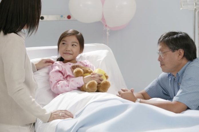 Parents with daughter in hospital