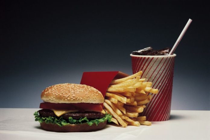 A hamburger, fries and soda.