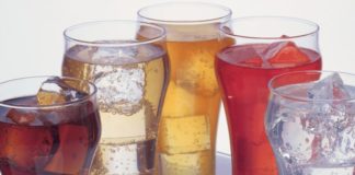 Glasses with ice and colourful sodas
