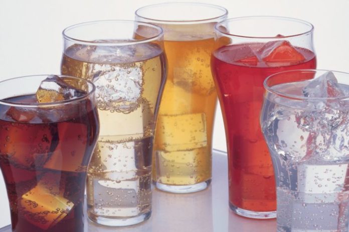 Glasses with ice and colourful sodas