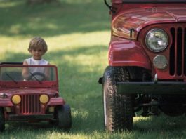 Child in toy jeep