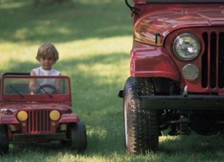 Child in toy jeep