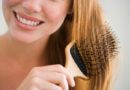 Woman combing hair