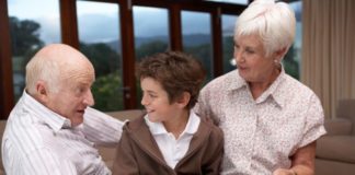 Grandparents talking with grandson.