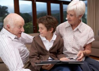 Grandparents talking with grandson.