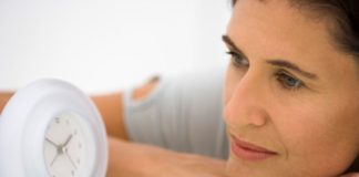 Woman watching clock