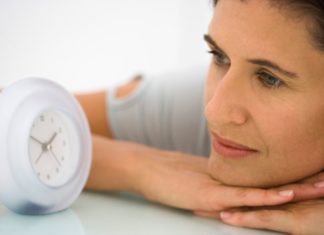 Woman watching clock