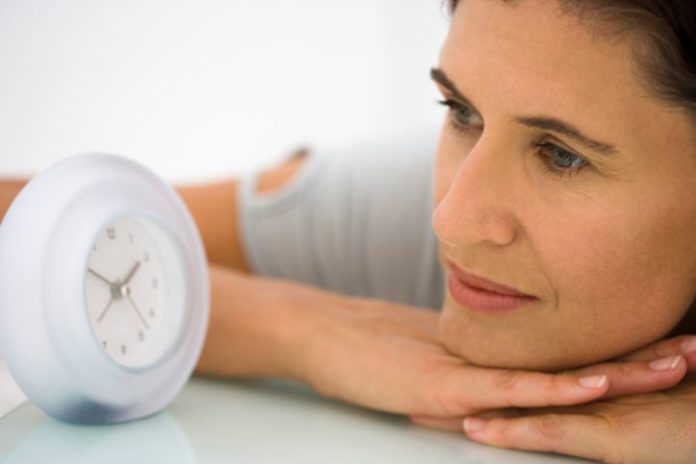 Woman watching clock