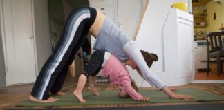 Woman and toddler doing yoga