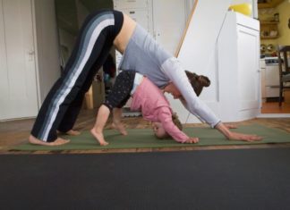 Woman and toddler doing yoga