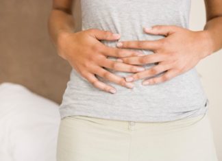 Woman holding stomach