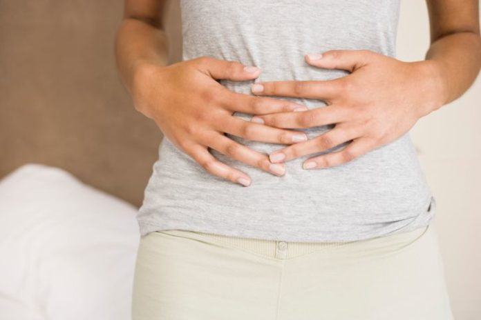 Woman holding stomach