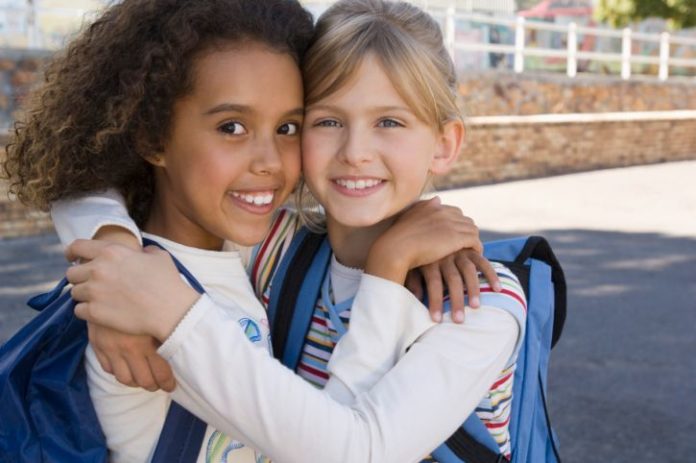 Happy schoolgirls