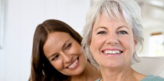 Portrait of smiling mother and daughter.