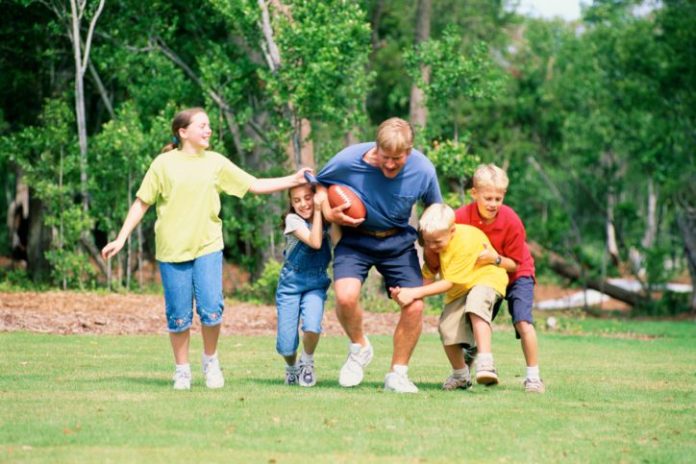 Family playing football