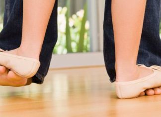 Girl dancing on Mum's feet