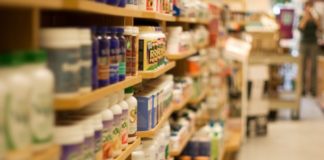 Rows upon rows of supplements in a shop.