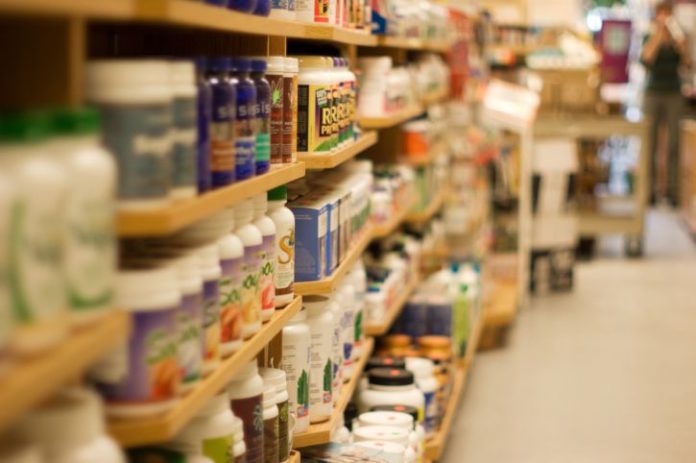 Rows upon rows of supplements in a shop.