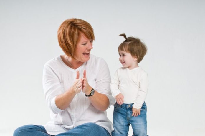 Candid studio shot of mother and daughter