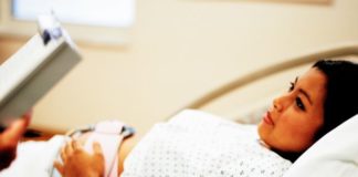 Pregnant woman in hospital gown