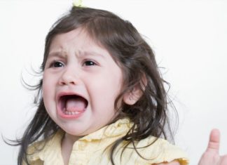 Studio shot of crying toddler girl.