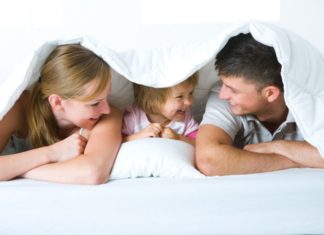 Family under blanket