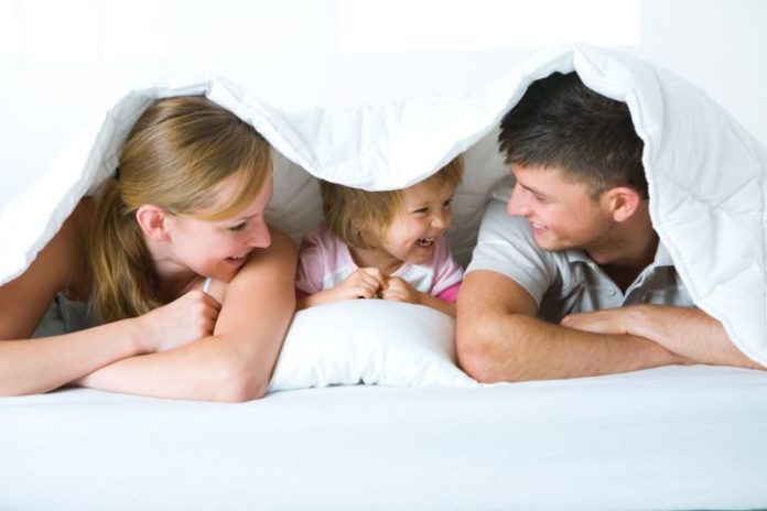 Family under blanket