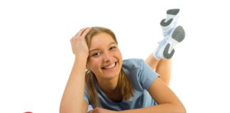 Smiling woman posing on exercise mat