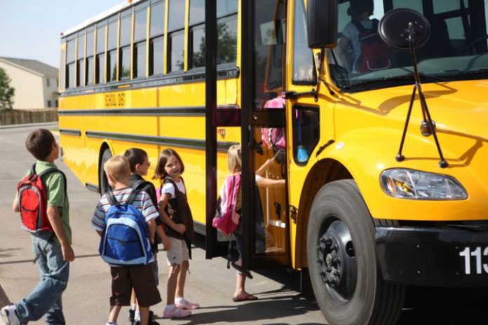 Kids boarding school bus