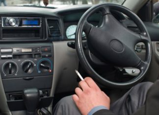 Man smoking in car