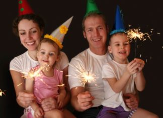 Family of four with sparklers