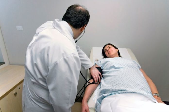 Pregnant woman receives a checkup