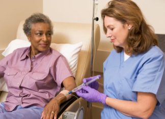 Nurse giving patient injection